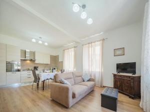 a living room with a couch and a table at Holiday Home Casa di Giò by Interhome in Marina di Massa