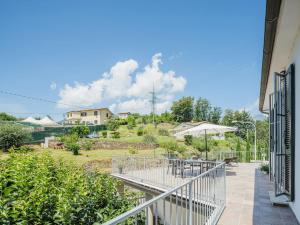 a balcony of a house with a table and chairs at Holiday Home Casa di Giò by Interhome in Marina di Massa