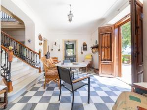 a living room with a table and chairs at Holiday Home Virgen de las Angustias by Interhome in Playas de Vera