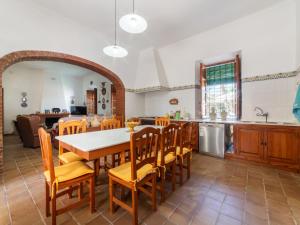 a kitchen and dining room with a table and chairs at Holiday Home Virgen de las Angustias by Interhome in Playas de Vera +66 photos