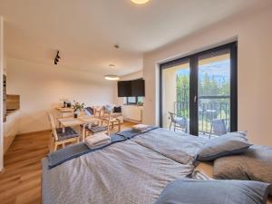 Rúm í herbergi á Studio Černý Důl-1 by Interhome