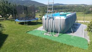 an image of a pool with a trampoline at Ranczo pod Klimoską in Rzyki