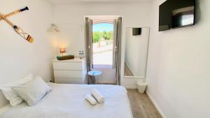 Postel nebo postele na pokoji v ubytování Casa Amarela Guesthouse + 37 fotografií