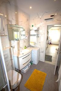 a bathroom with a sink and a mirror at HOLIDAY HOME KATE in Vis