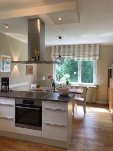 a kitchen with a sink and a stove top oven at Ferienhaus Hengsbecke 24 in Medebach