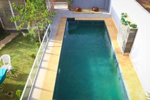 an overhead view of a swimming pool in a backyard at GreenLand in Bir Jedíd Saint-Hubert