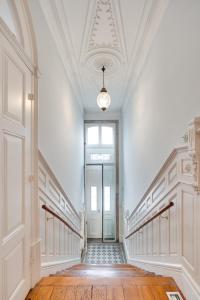 an empty hallway with a staircase and a door at Porto Premium Villa in Porto