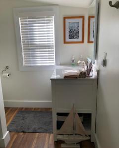a bathroom with a table and a window at Farmhouse 316 of Milton in Milton