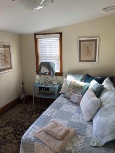 a bedroom with a bed and a table at Farmhouse 316 of Milton in Milton