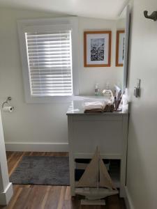 a bathroom with a sink and a window at Farmhouse 316 of Milton in Milton