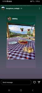 a screenshot of a picture of a picnic table at Bungalows Malagić in Gusinje