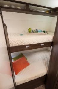 a bedroom with two bunk beds in a trailer at easicampers in Wigan