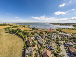 an aerial view of a subdivision next to a river at Pass the Keys Charming Harbourside Cottage in Emsworth