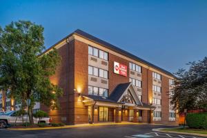 a hotel building with a sign on the side of it at Best Western Plus Alexandria Fort Belvoir in Alexandria