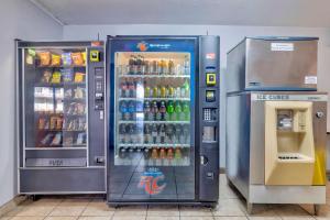 a large soda machine next to a drink cooler at Motel 6 Effingham, IL in Effingham +31 photos