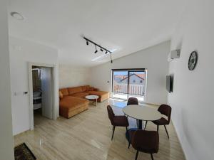 a living room with a couch and a table at Zvončica Deluxe in Vodice