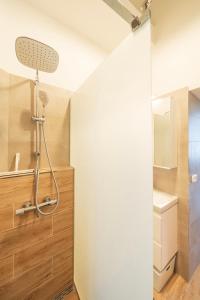 a bathroom with a shower and a sink at Shining bright two bedroom apt next to Andrassy ave in Budapest