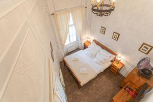 Ένα ή περισσότερα κρεβάτια σε δωμάτιο στο Loreta Hotel