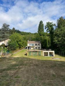 a house sitting on top of a grass field at Maison de campagne proche Disney in Chamigny