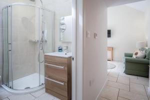 a bathroom with a shower and a sink at Caradog - 1 Bedroom - St Ishmaels in Saint Ishmaels