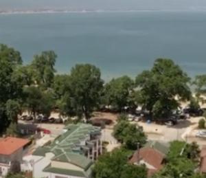 an overhead view of a park with trees and umbrellas at Stefanidis Platani Beach in Stavros