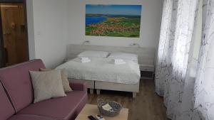 A bed or beds in a room at Apartmány Pemag Mikulov