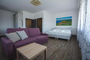 A bed or beds in a room at Apartmány Pemag Mikulov
