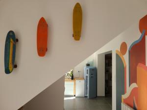 a hallway with surfboards hanging on the wall at L'entre-deux in Périgueux