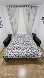 a bedroom with a large bed with curtains at Puerto Rico Top Teide and Amadores View in Puerto Rico de Gran Canaria +65 photos
