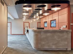 an office with a lobby with a reception counter at B&B HOTEL Cergy Port 4 étoiles in Cergy