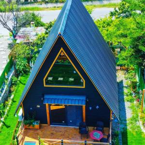 an overhead view of a house with a blue roof at El-Ya Bungalov ve pansiyon in Dalaman