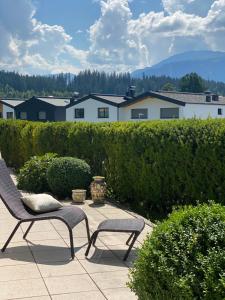 a pair of chairs sitting on a patio at Casa45 in Westendorf
