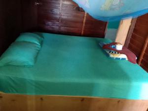 a bunk bed with a toy on top of it at Kulap Kao Bungalow in Ban Donsôm Tai
