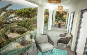 a balcony with chairs and a table on a house at Villa Sunset Loft in Vir