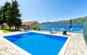 a swimming pool with a view of the water at Villa Gabriela Korcula in Korčula +48 photos