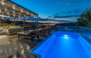 a swimming pool in a house with a patio at Villa Bella in Mrljane