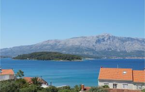 a view of a large body of water with mountains at Villa Veritas in Lumbarda