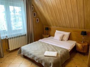 Posteľ alebo postele v izbe v ubytovaní APLIT GUEST HOUSE