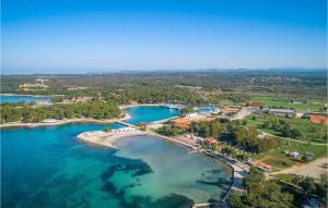an aerial view of a beach with blue water at 2 Bedroom Nice Home In Sveti Ivan in Sveti Ivan