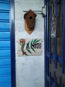 a door with a birdhouse and a sign on a wall at Il Nido in Fiano Romano