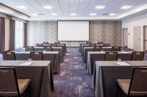 a conference room with tables and chairs and a projection screen at Homewood Suites By Hilton New Orleans French Quarter in New Orleans +50 photos