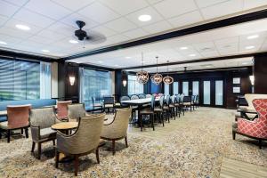 a dining room with a table and chairs at Hampton Inn Murrells Inlet/Myrtle Beach Area in Myrtle Beach