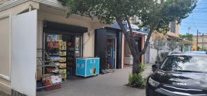a car parked in front of a book store at Studenti Studio's in Tirana +26 photos