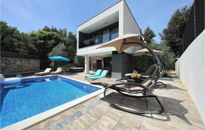 a swimming pool with chairs and a house at Villa Mara in Zaton +32 photos