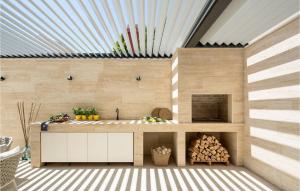a kitchen with a counter and a fire place at Villa Tereza in Zadar