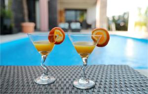 two glasses of orange juice sitting on a table at Villa Nerina in Nin