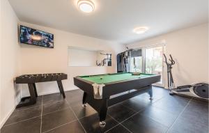 a room with a pool table and a treadmill at Villa Oasis in Sukošan