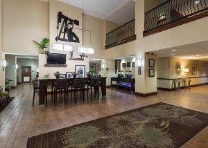 a large living room with a dining table and chairs at Hampton Inn Odessa in Odessa