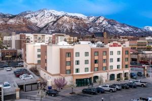 an aerial view of a city with mountains in the background at Hilton Garden Inn Ogden in Ogden