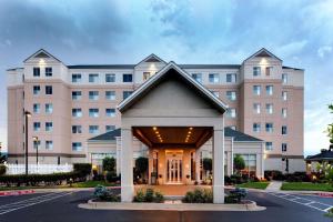 a building with a gazebo in front of it at Hilton Garden Inn Oklahoma City Airport in Oklahoma City